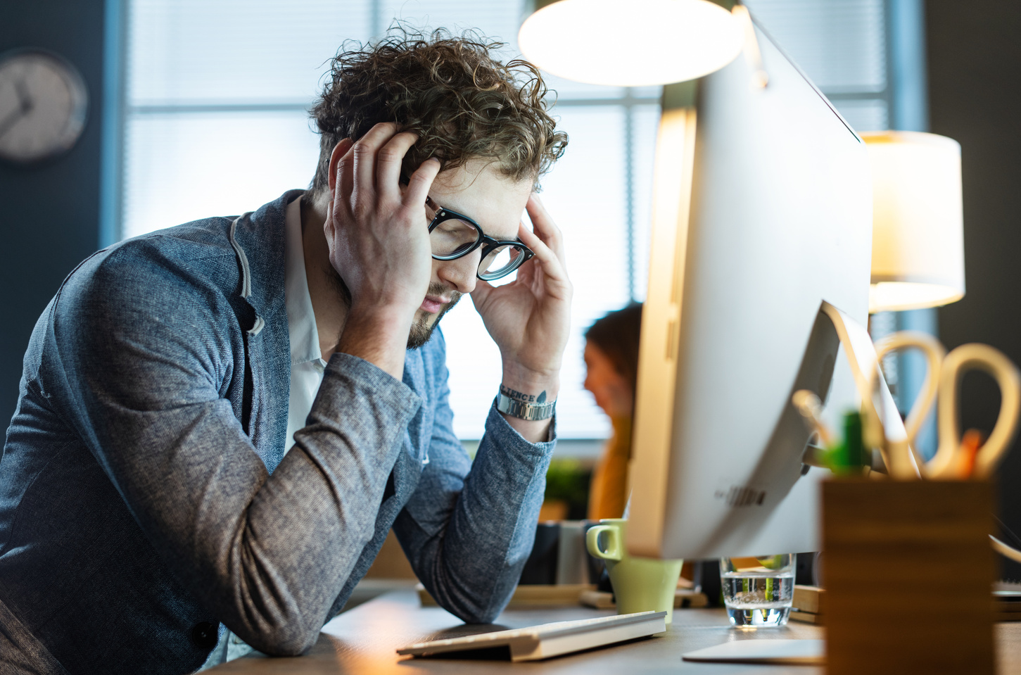 Stressed office worker with headache